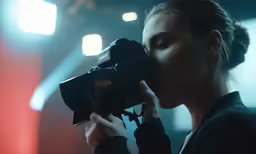 a woman taking a picture with her digital camera