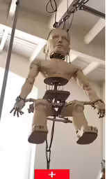 a toy made out of human body in an office