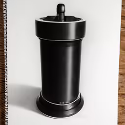 a black and white photograph of an automatic paper towel dispenser