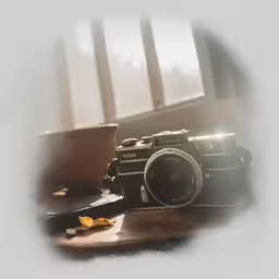 a black and white photo of a camera and some food