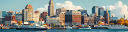 this is a large city skyline with several boats in it