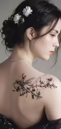 a woman in a dress with tattoos and a flower pinned to her back