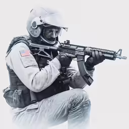 a man kneeling down holding a rifle