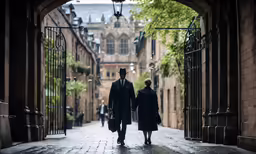 two men and woman walking on a brick road