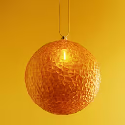 large orange spherical hanging light with chain