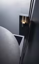 two light fixtures in a very modern bathroom