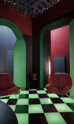 the room has green panels and checkered floor