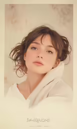 a woman in white clothing looking off to the side