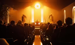a group of people sitting on top of chairs