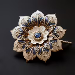 a flower brooch with a blue center