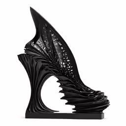 a black sculpture is shown on a white background
