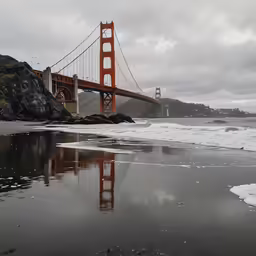 a suspension bridge on the coast near the water