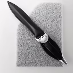 the black watch is resting on top of the fabric