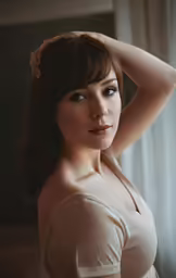 a woman with dark hair in a top