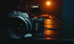 an old camera on a table with a flash