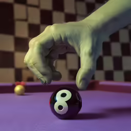 the hand of a person about to roll a ball on a pool table
