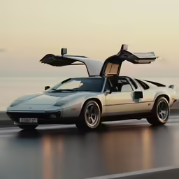 a white sports car is being driven down the road