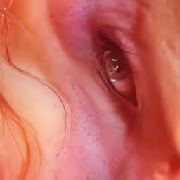 an eye that is open with only the top part of the eye visible