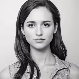 a woman is posing for a picture in black and white