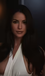a close up of a woman in a white dress