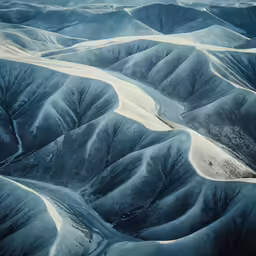 a large number of mountains covered in snow