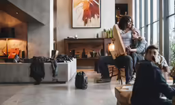 people in an office looking at their belongings