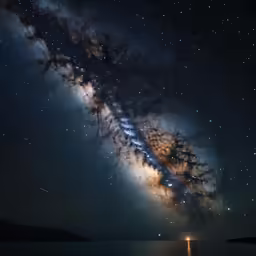 a long exposure photo of the night sky over the ocean