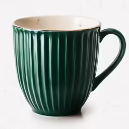 green striped ceramic cup on white background