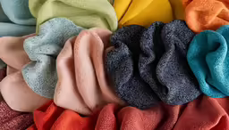 a blanket that has been made with various colored pieces
