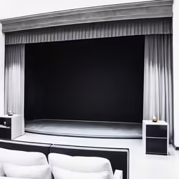 a white sofa sitting next to a table
