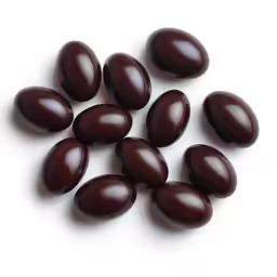 a group of brown eggs laying on top of each other