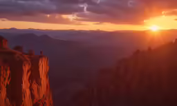 the sun setting over a rocky valley with some very tall rocks