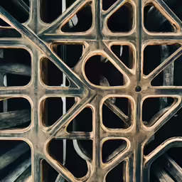 a geometrically made concrete surface with metal rings and lines