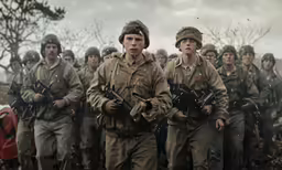 there are men walking through the woods in uniform
