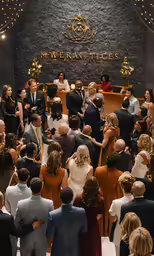 wedding party on stage surrounded by an audience