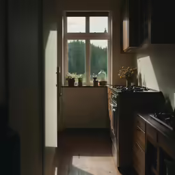a kitchen with a window that shows the outside