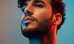 a man with an artistic makeup has red hair