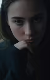 a close up of a young woman sitting down