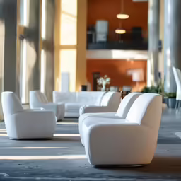 a large hall with couches, chairs and tables