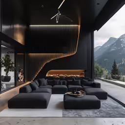 the living room is filled with black couches and a fireplace