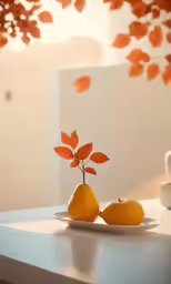 two pears with leaves on a white plate