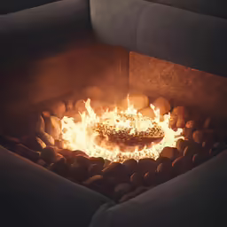 a large fire with rocks coming out of it