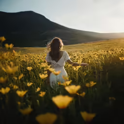 woman in sunflower field walking away from camera