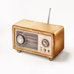 an old fashioned radio sits in a shadow on the floor