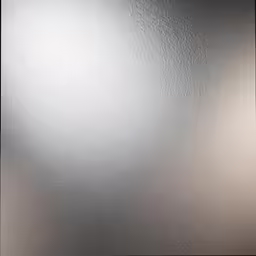 a shiny silver metal surface with white streaks