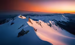 there is a mountain with some snow on it