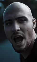 a man with his mouth open in a black shirt