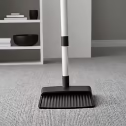 a sweeping mop that is on the floor