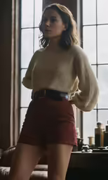 a young girl wearing a short skirt is standing next to a window