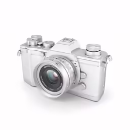 a silver digital camera is shown with a large lens